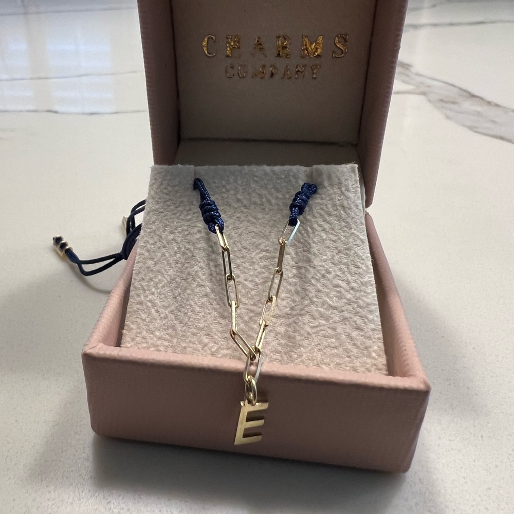 Charms Company 14k Gold E Initial bracelet with Navy Blue Cord
